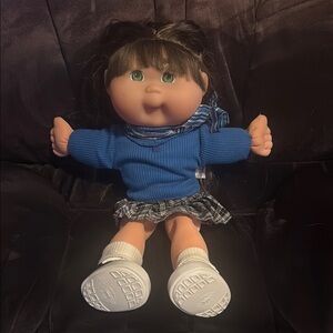 Blue cheerleading outfit and Green eyed Doll with Soft Body